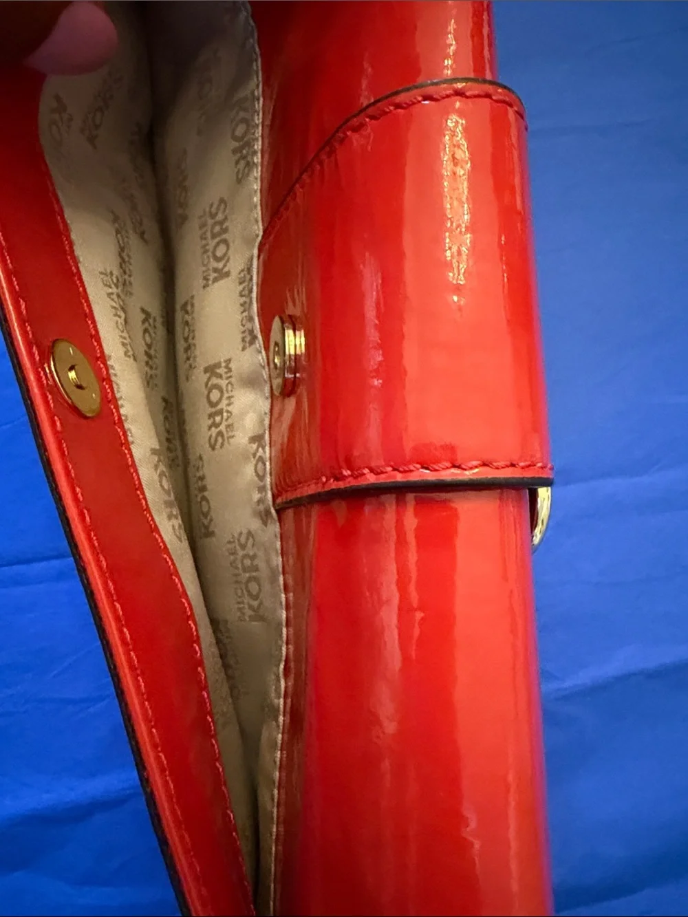 Michael Kors Glossy Orange Patent Leather Clutch with Gold Buckle